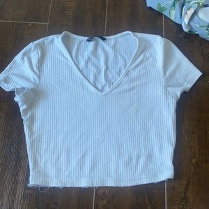 It’s a bad top lol white crop top the lace literally fell of